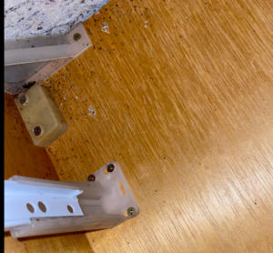 German cockroach droppings near a drawer slide