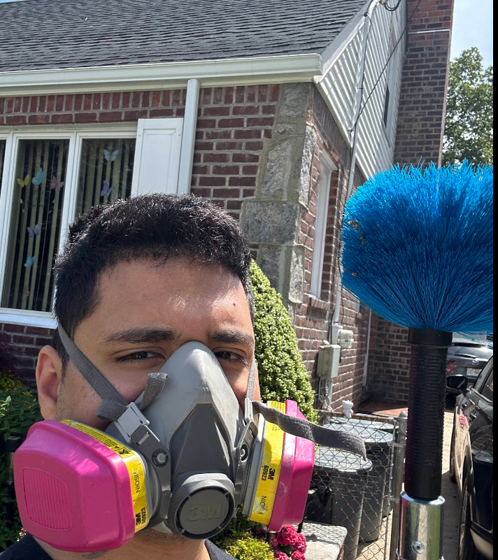 New York Exterminating technician performing pest service at an NYC building