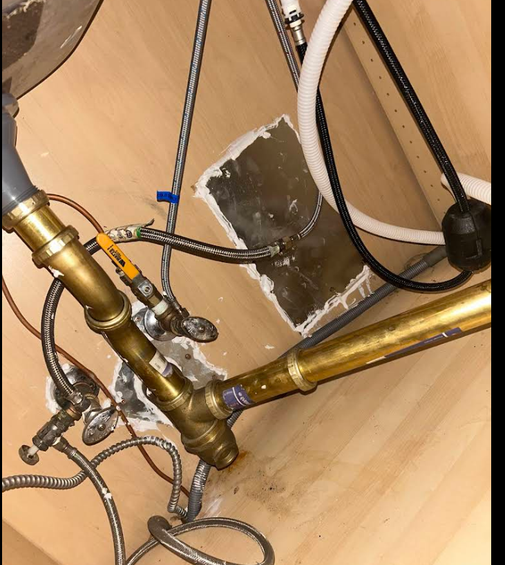 Large under-sink openings sealed with metal and elastomeric sealant, NYC
