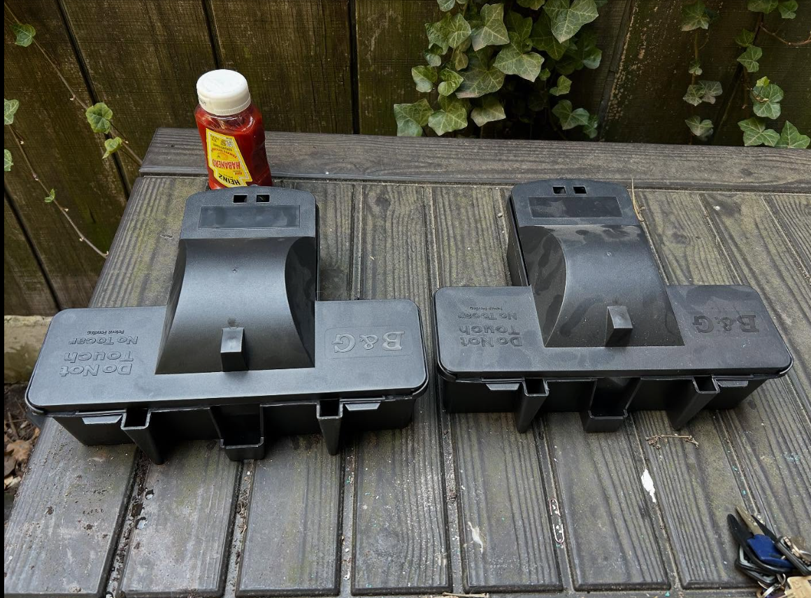 Exterior rodent bait stations documented during service