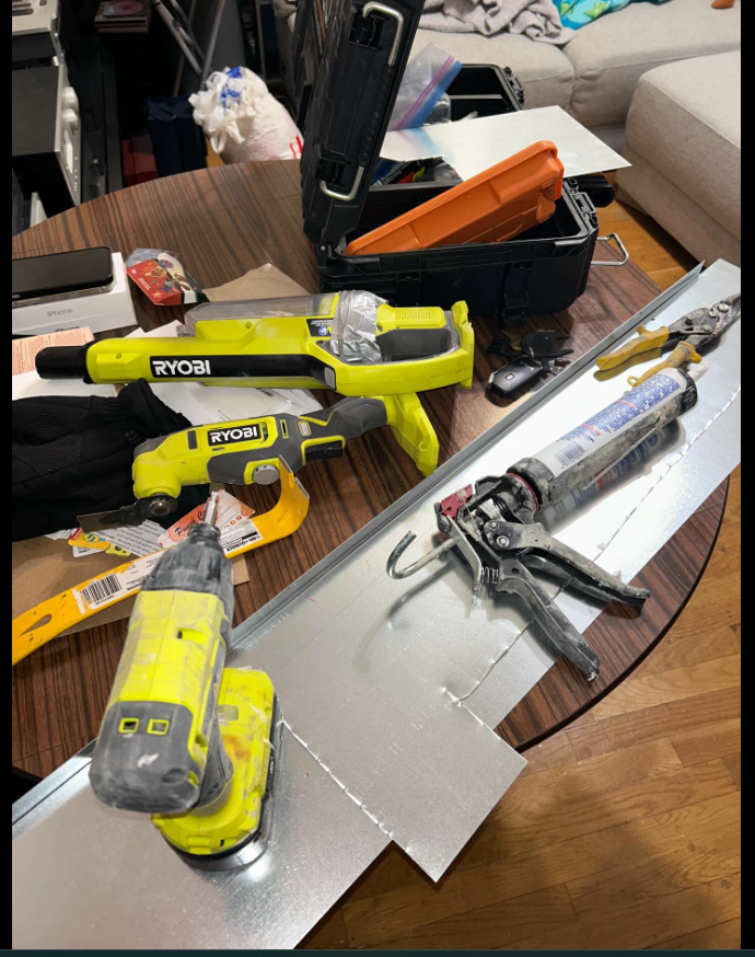 Tools used for rodent exclusion and sealing — drill and caulking gun