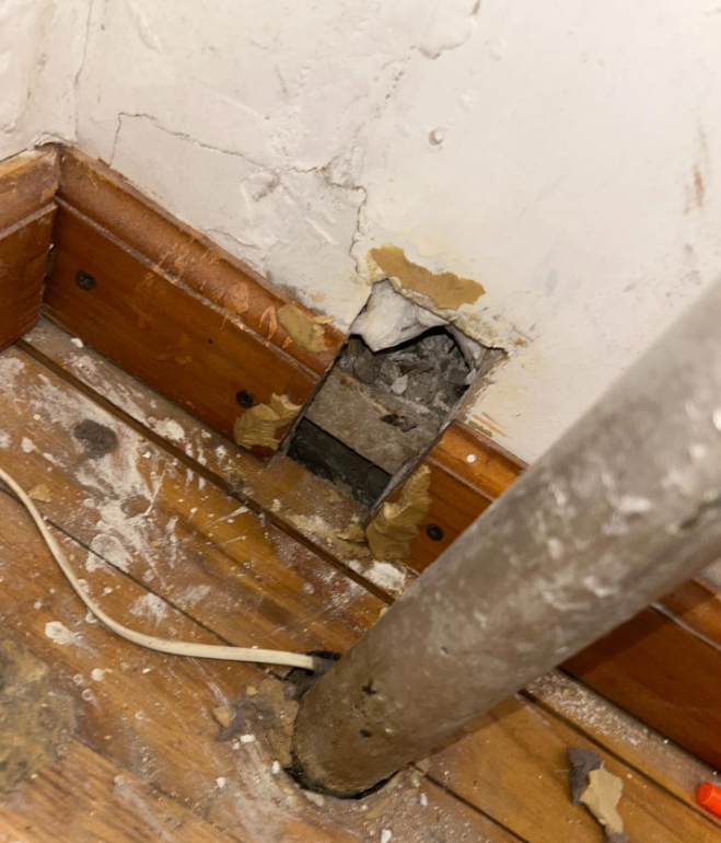 Opening around piping sealed during rodent exclusion work