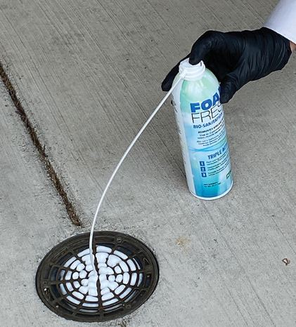 Foam Fresh bio-sanitation foam applied into a floor drain through an extension tube