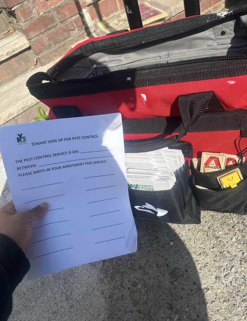 NYE tenant sign-up sheet next to a technician work bag with traps